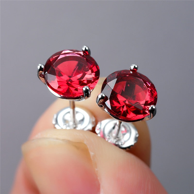 Round 3-claw earrings with red crystal zircons and screw closure